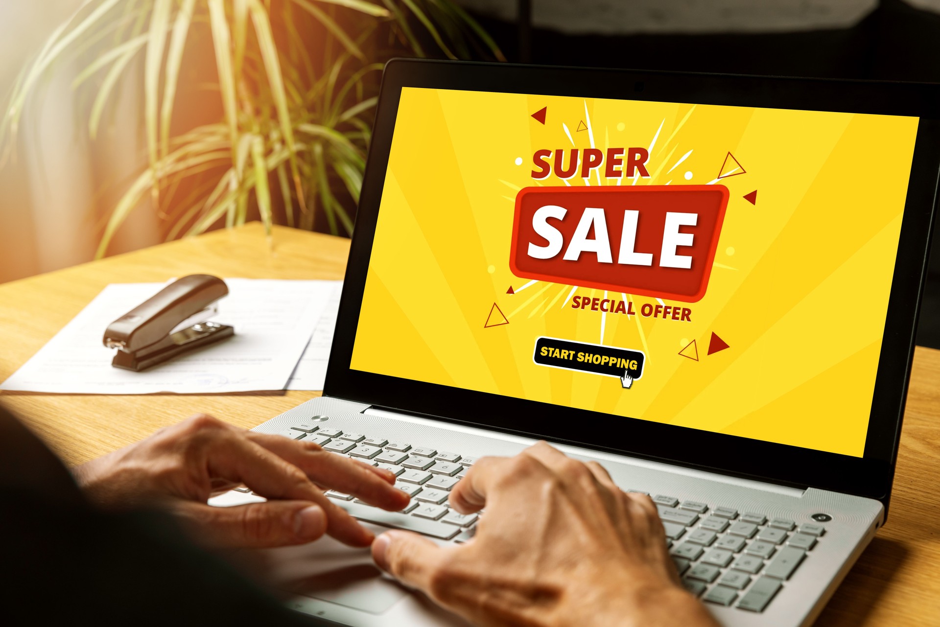 person using laptop computer at home for super sale online shopping. internet marketing
